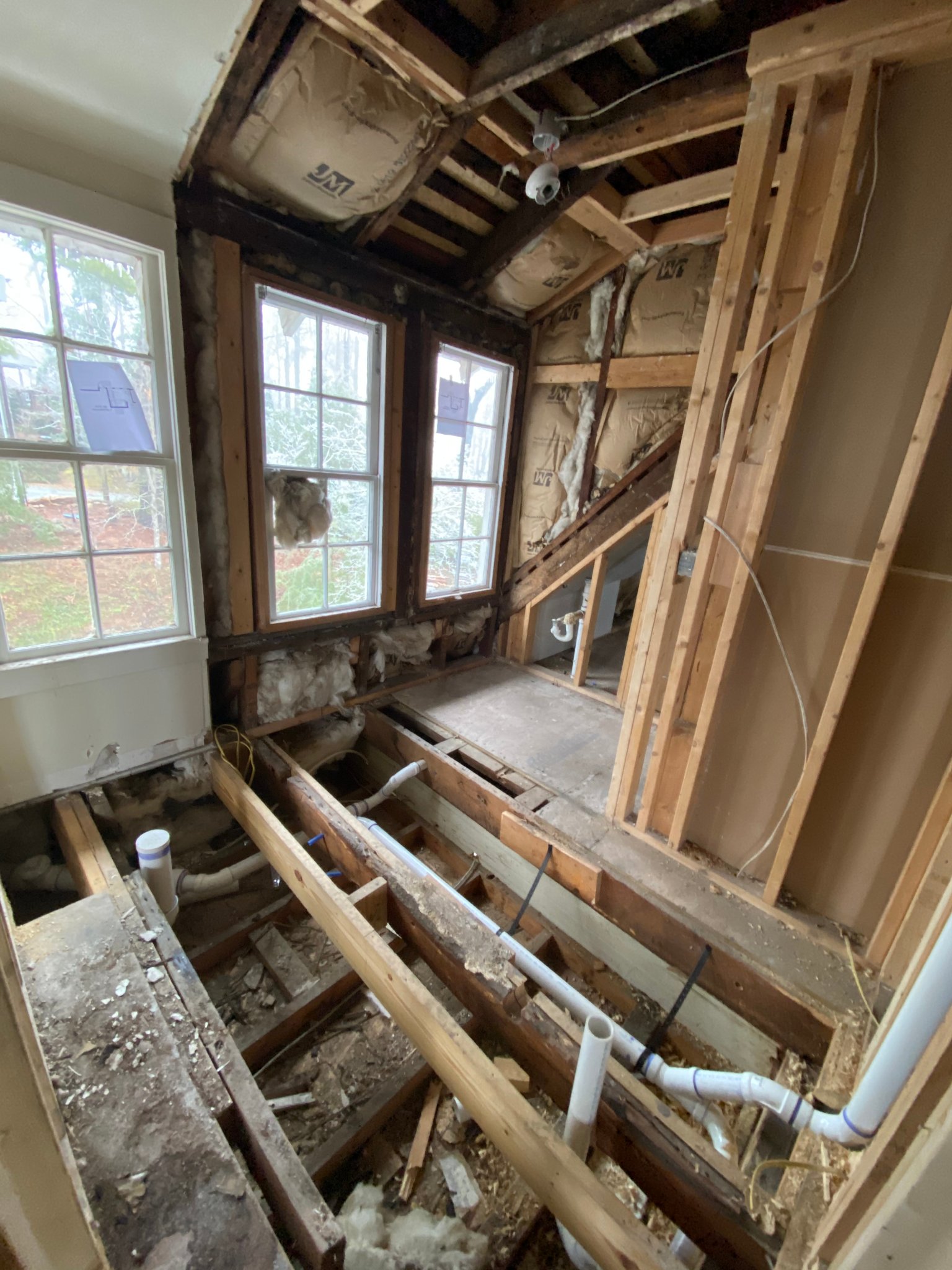 Guest room gut — subfloor & plumbing rough-in