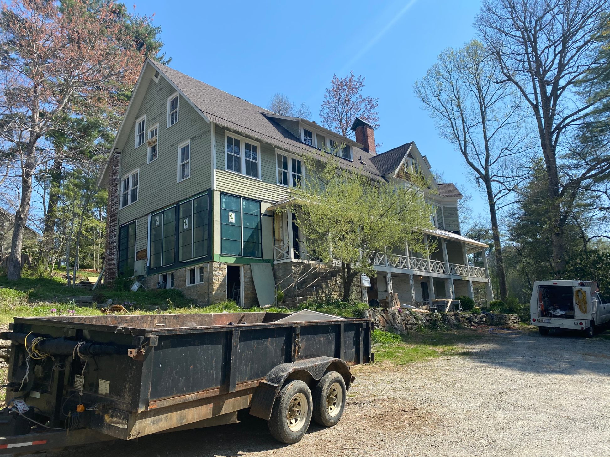 Exterior spring 2021 — new windows & dumpster on site