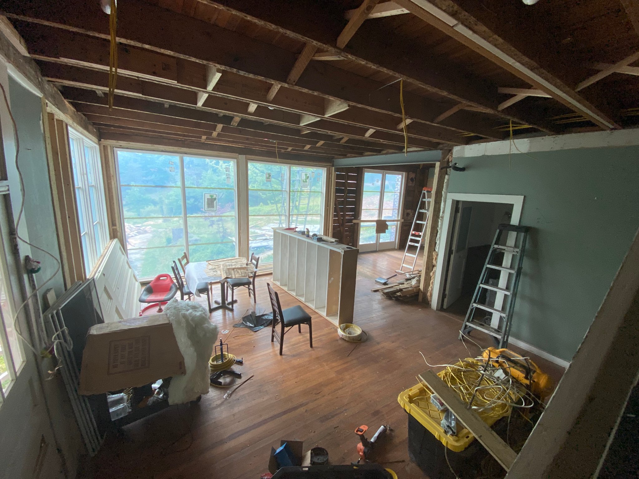 Second floor — new windows installed, mountain views revealed